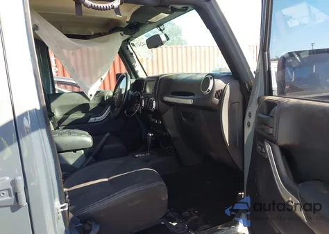 2015 Jeep Wrangler Unlimited Sahara z USA, uszkodzony, nr VIN 1C4BJWEG0FL707511